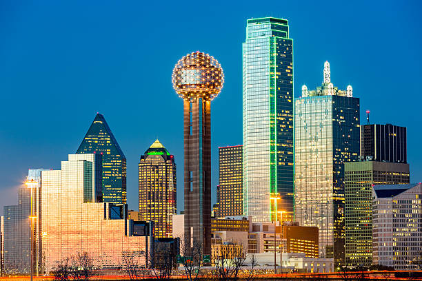 dallas skyline at sunset under a clear blue sky.