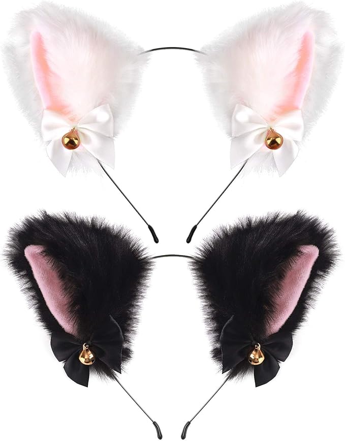 Two Fly Clothing Co. plush cat ear headbands in white and black with satin bows and gold bells.