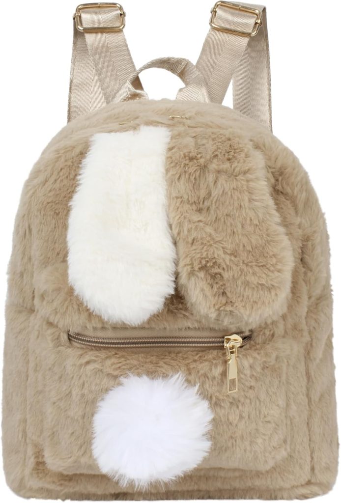 A small, tan-colored plush backpack made of soft faux fur, featuring white floppy bunny ears on the front pocket and a white fluffy pom-pom tail at the bottom.