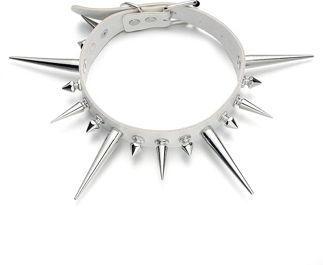 A white vegan leather choker featuring an adjustable silver-tone buckle and a row of alternating long and short metallic silver spikes.