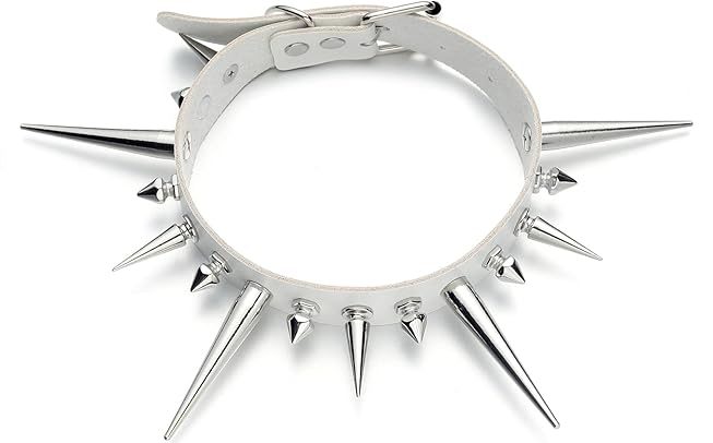 A white leather or faux-leather choker necklace featuring a series of silver-toned metal spikes of varying lengths. The design includes long, sharp focal spikes interspersed with smaller, conical studs, secured with a classic silver buckle and metal eyelets.