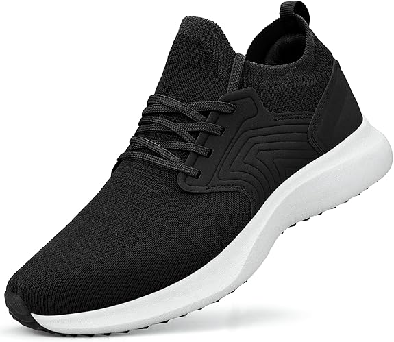 A pair of black slip-on sneakers featuring a breathable, diamond-patterned mesh upper. The shoes have a thick white platform rubber sole, black elastic side panels, and a pull-tab at the heel for easy wear.