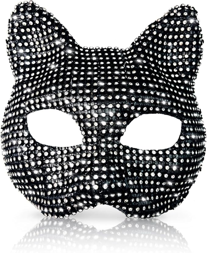 A close-up, front-facing view of a black cat-shaped masquerade mask completely covered in shimmering silver rhinestones. The mask features pointed ears and large eye cutouts, reflecting light against a solid white background with a subtle reflection at the base.