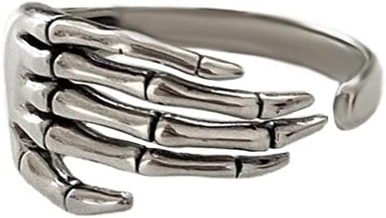 A silver-toned metal ring designed to look like a skeletal human hand wrapping around the wearer's finger. The ring features detailed bone structures for the fingers and thumb, with an open-back adjustable band.