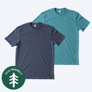Two blank Allmade heavyweight recycled cotton unisex t-shirts, one in deep navy and one in teal, displayed on a white background with a green "Eco Friendly" tree icon for custom design services.