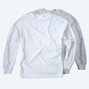 Two blank classic long sleeve t-shirts, one in bright white and one in heather grey, featuring a standard crew neck and ribbed cuffs for custom apparel design services.