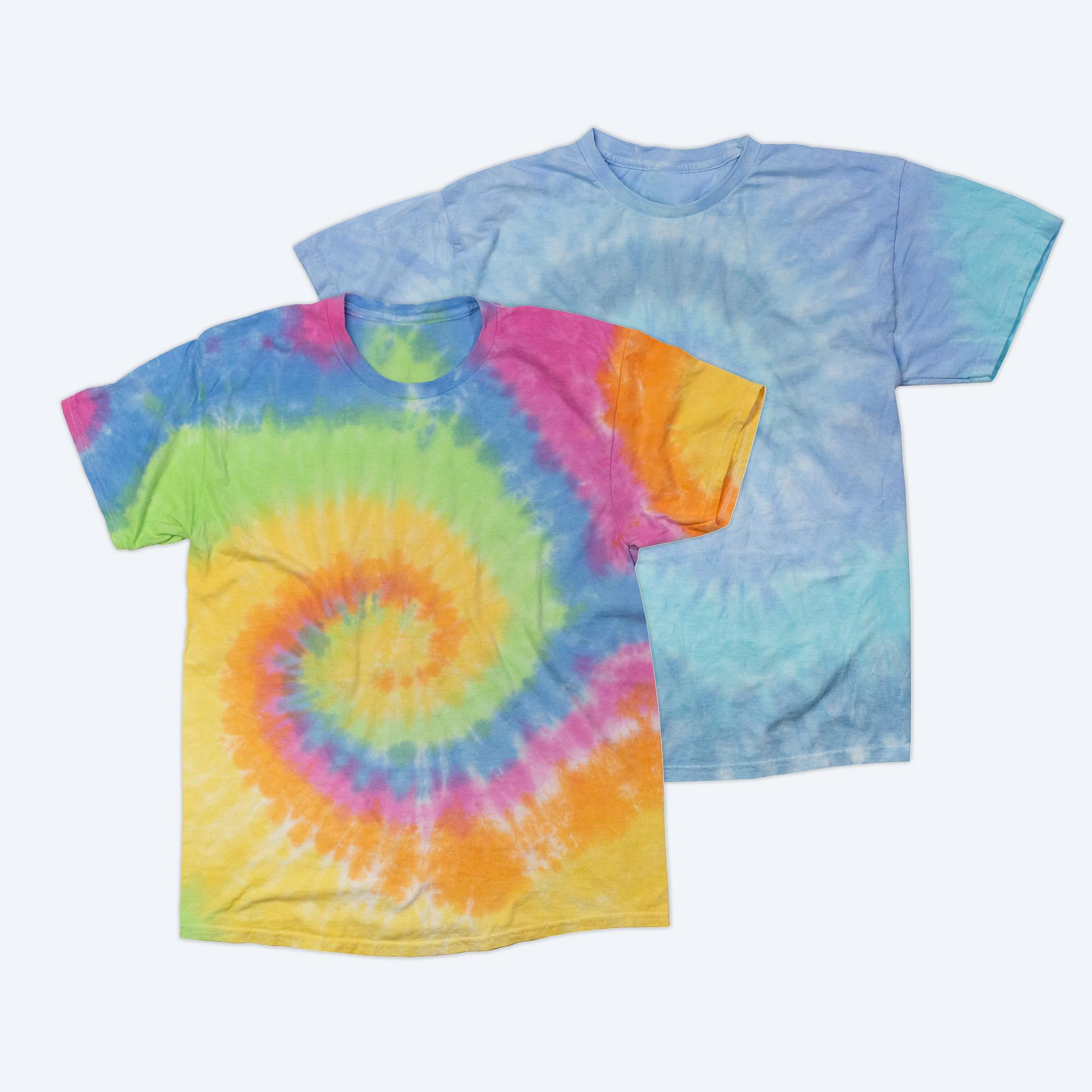 Two blank classic tie-dye t-shirts, one featuring a vibrant multi-color rainbow spiral and one in a subtle blue and white cloud wash, displayed on a clean white background for custom apparel design services.