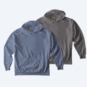 Two custom Comfort Colors Pullover Hoodies in a vintage-washed denim blue and a charcoal grey, displayed for Fly Clothing Co’s custom design service in LA and NYC.