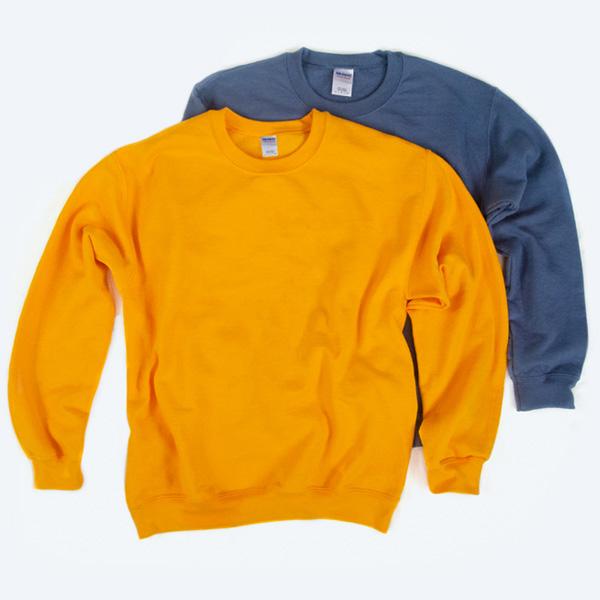 Two blank Gildan crewneck sweatshirts, one in golden yellow and one in slate blue, layered on a white background for custom design services.