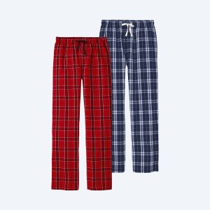Two pairs of soft cotton flannel pajama pants—one in a red and black buffalo check pattern and one in a navy and white tartan plaid—featuring an elastic waistband and white adjustable drawstring.