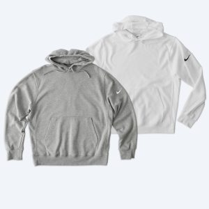Two custom Nike Club Fleece Pullover Hoodies in heather grey and white, featuring the iconic Nike swoosh on the sleeve, part of Fly Clothing Co’s premium design service in LA and NYC.