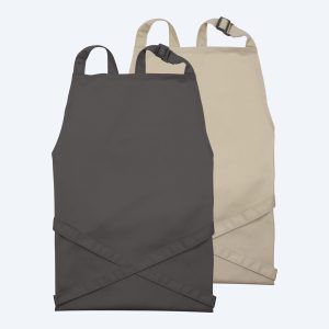 Professional recycled fabric aprons in charcoal and sand, designed by Fly Clothing Co. for Los Angeles boutiques and New York City cafes, featuring adjustable neck straps and a minimalist aesthetic.