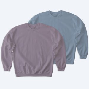 Two blank Softstyle crewneck sweatshirts in dusty mauve and light slate blue colors, displayed diagonally on a white background for custom apparel design services.
