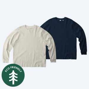 Two blank Stanley Stella Unisex Freestyler heavyweight long sleeve t-shirts in natural raw and french navy, featuring a green eco-friendly badge for custom design services.
