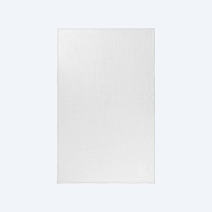 A high-quality, white waffle-weave custom tea towel from Fly Clothing Co., featuring a textured honeycomb pattern and clean stitched edges, perfect for a modern LA kitchen or a classic NYC brownstone.