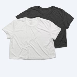 Two blank women's flowy cropped t-shirts, one in crisp optic white and one in charcoal grey heather, featuring a relaxed boxy fit and short sleeves for custom apparel design services.