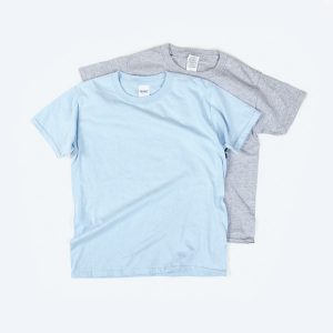 A high-quality mockup of a youth unisex short-sleeve t-shirt featuring a classic crew neck and a smooth cotton finish, displayed in a neutral tone to serve as a versatile canvas for custom streetwear branding.