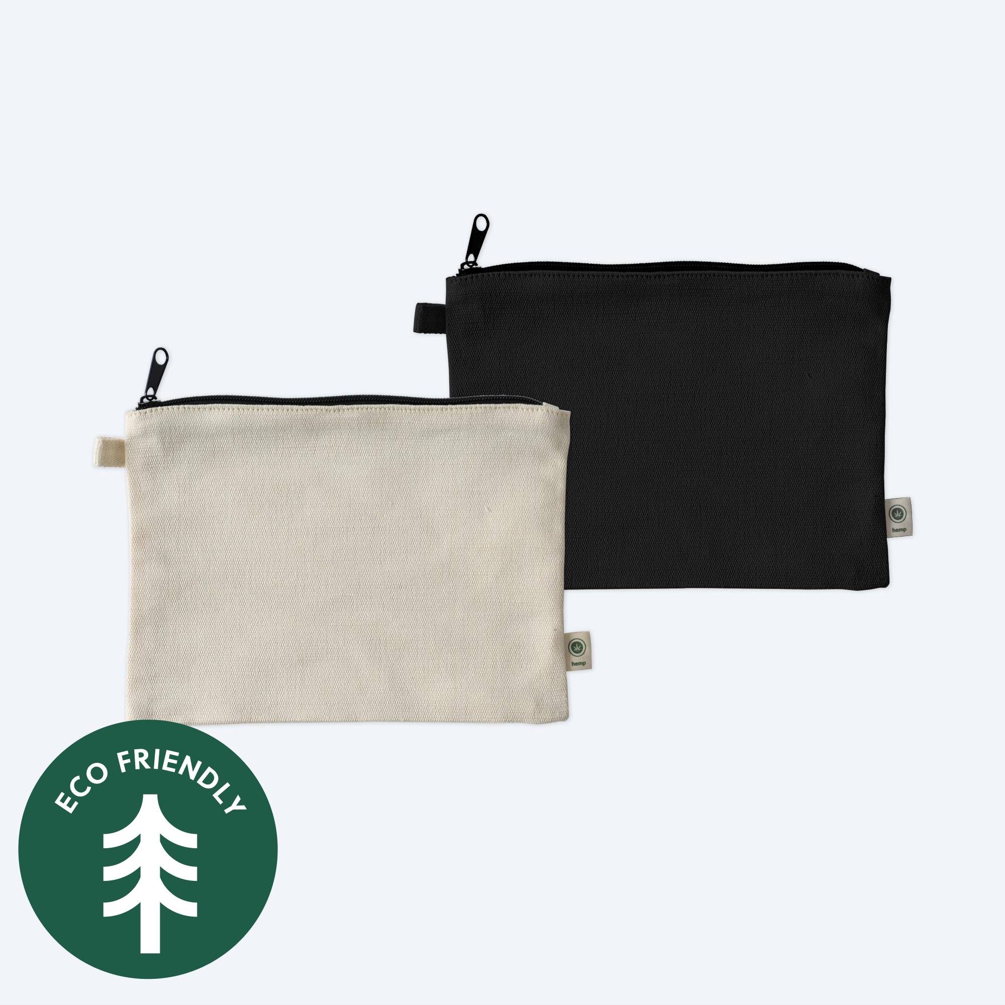 Two blank 9x7 hemp blend zippered pouches, one in natural cream and one in deep black, featuring visible hemp fibers and displayed on a clean white background with a green "Eco Friendly" tree icon for custom branding design services.
