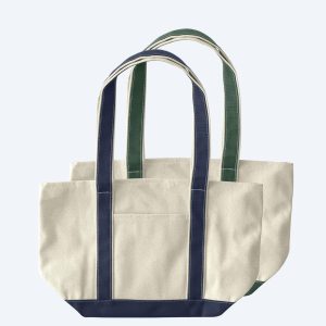 Two large custom two-tone canvas tote bags with contrast straps, featuring spacious structured bases and open tops, displayed on a clean white background for branding design services.