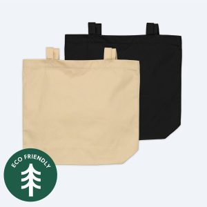 Two blank organic cotton tote bags, one in a natural ecru cream and one in a soft taupe brown, displayed on a clean white background with a green "Eco Friendly" tree icon for custom branding design services.
