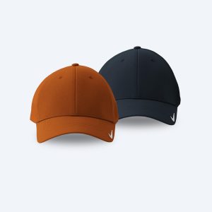 Two blank Nike Dri-FIT Legacy Performance Caps, one in orange and one in navy blue, featuring curved bills and a small white Swoosh on the lower left brim, displayed on a clean white background for custom printing design services.