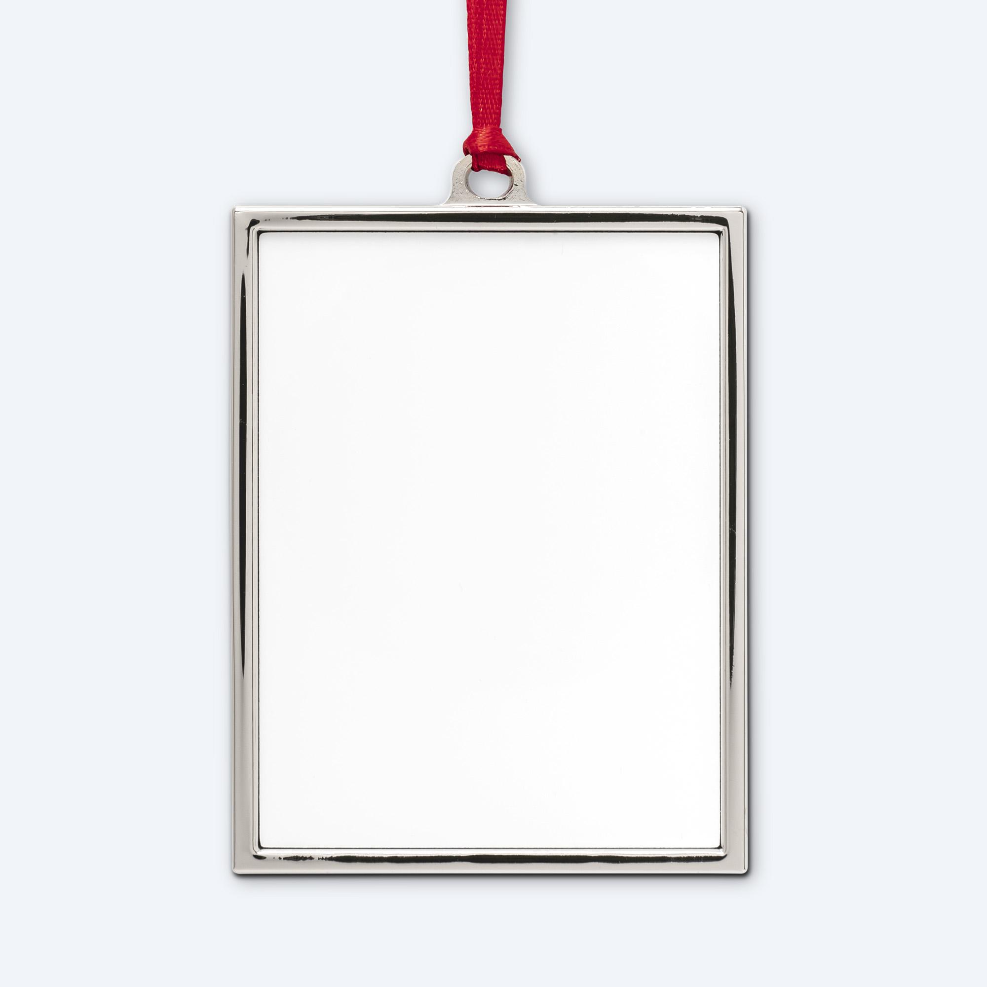 A single blank vertical silver metal portrait frame ornament with a high-polish finish and matching internal lining, hanging from a vibrant crimson red satin ribbon, displayed on a clean light grey background for professional full-color printing design services.