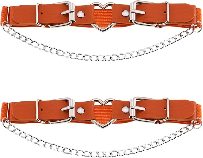 The bright orange leather flawlessly matches the outfit's top and knee-high boots.